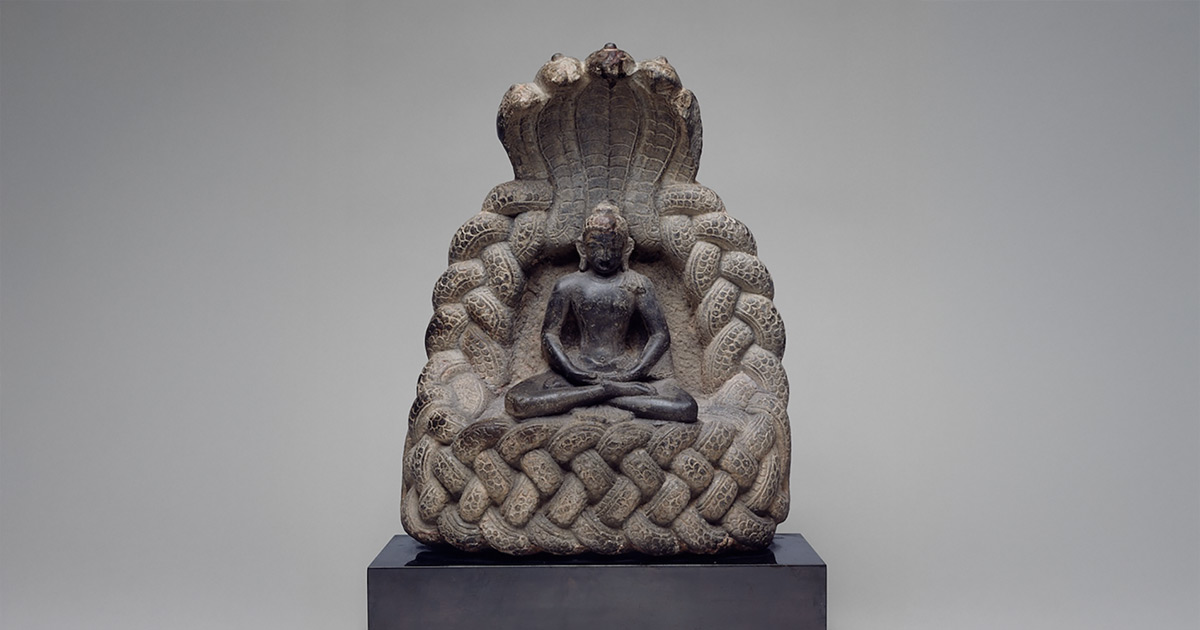 The Buddha under the protection of the Serpent King Muchalinda, sheltering him with a sacred hood during a storm. Image courtesy of the Art Institute of Chicago.